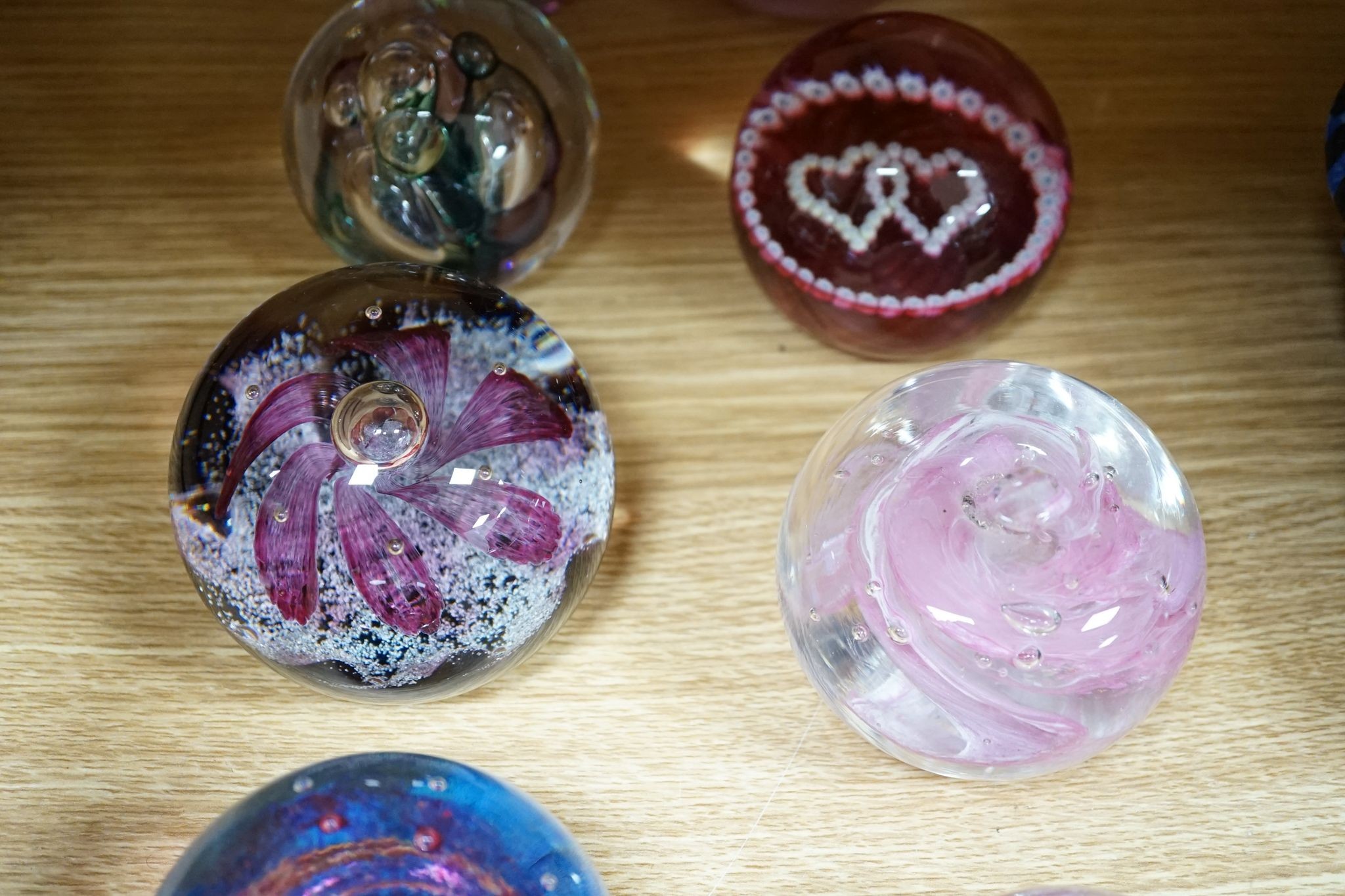 A group of glass paperweights including Caithness